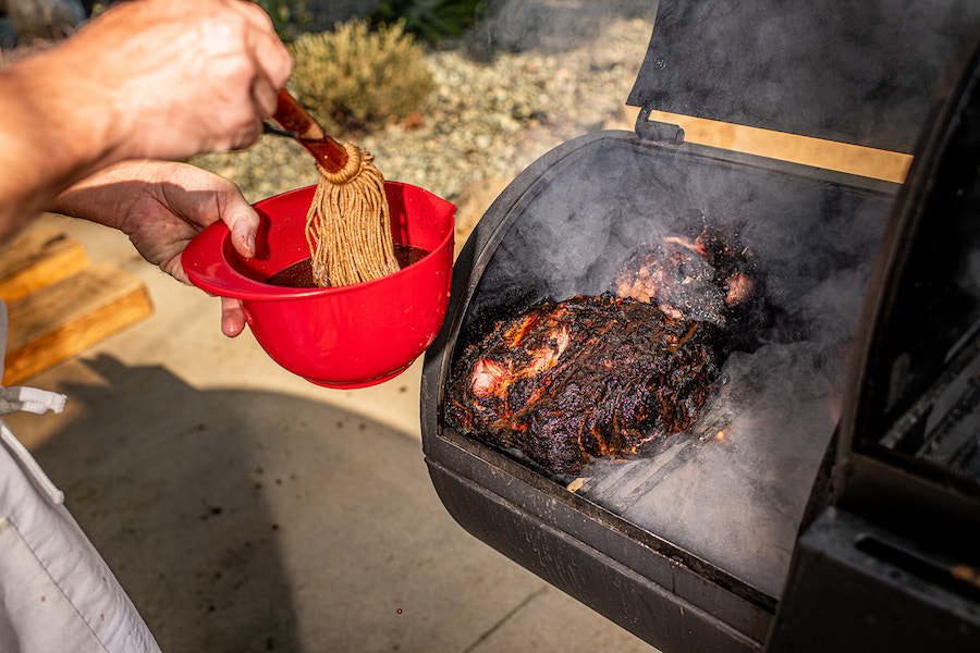 Boo and Henry's Top 5 BBQ Tips for Smoking Meat - basting and smoking meat on grill